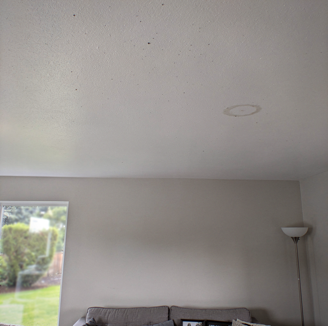 recessed lighting cans installed in flat bare ceiling
