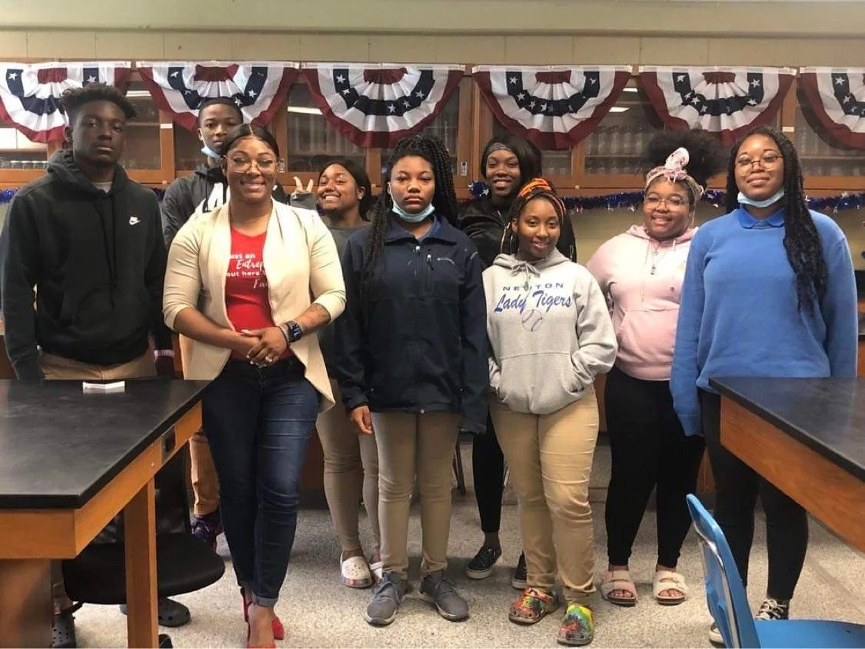 Keyshuna Cole presenting on Goal Setting at Alma Mater, Newton High School, pictured with students.