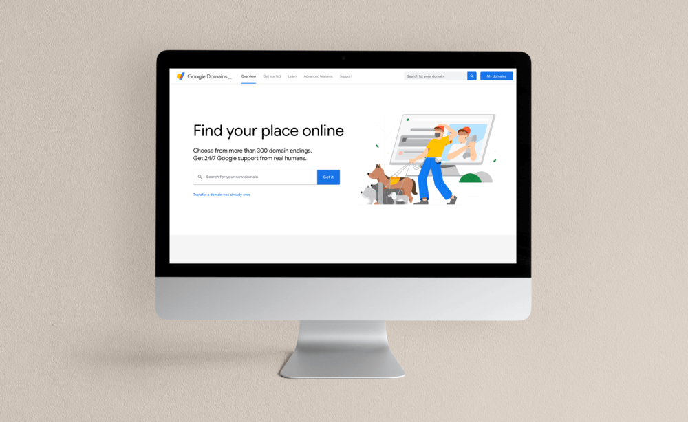 Silver iMac displaying Google Domains website on neutral tone background