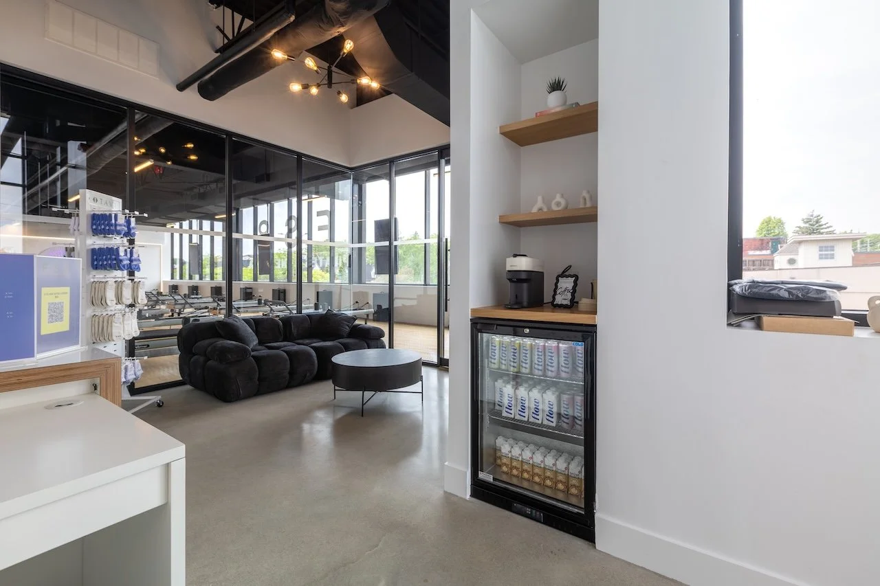 Hospitality-inspired lounge and refreshment area at FS8 Port Credit designed and built by Westrose Construction