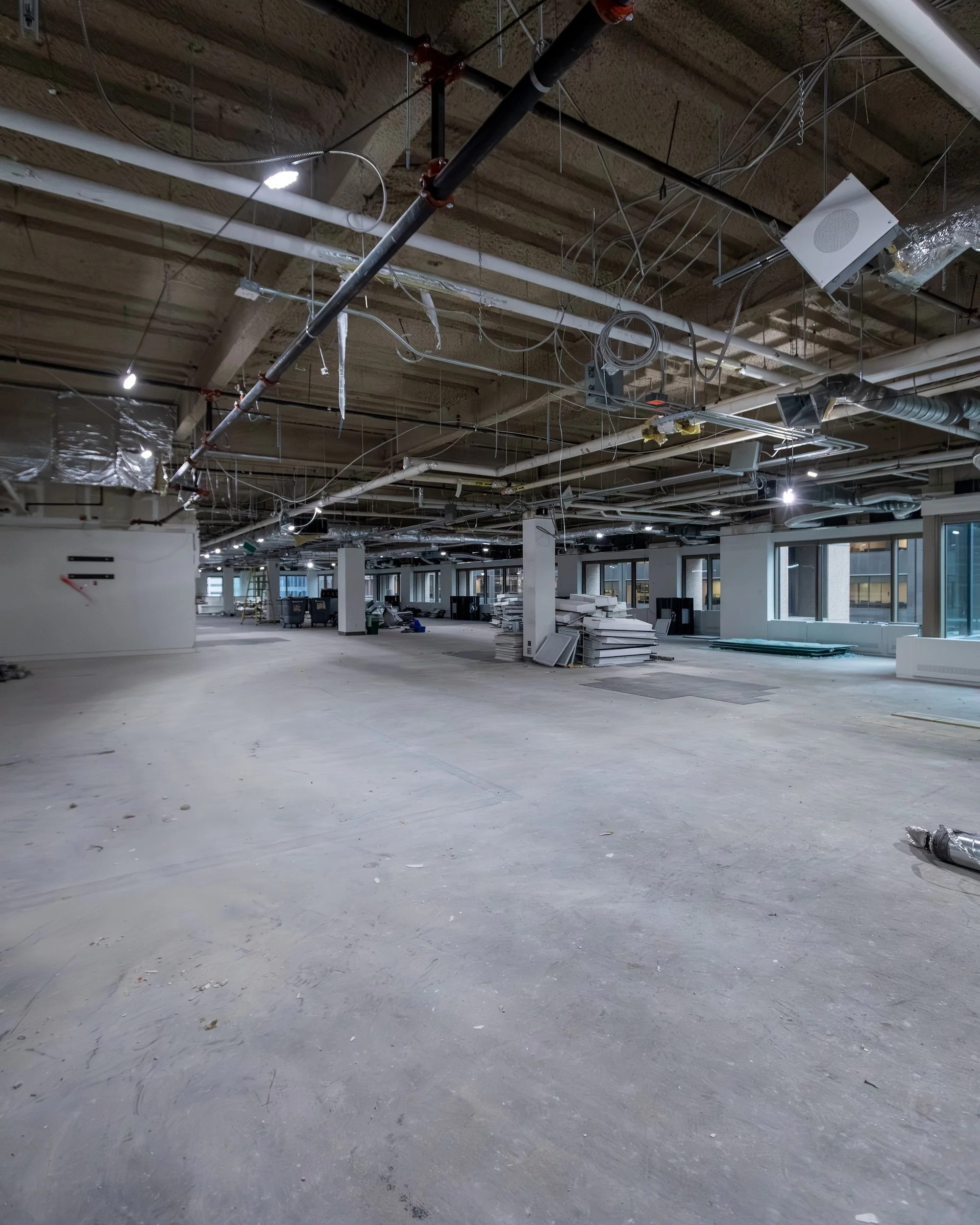 Large open commercial floor plate after full demolition and structural renovation by Westrose Construction at King Street Toronto, ready for new build-out
