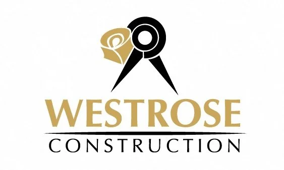 A logo for WestRose Construction featuring a rose and a compass in gold and black colors.