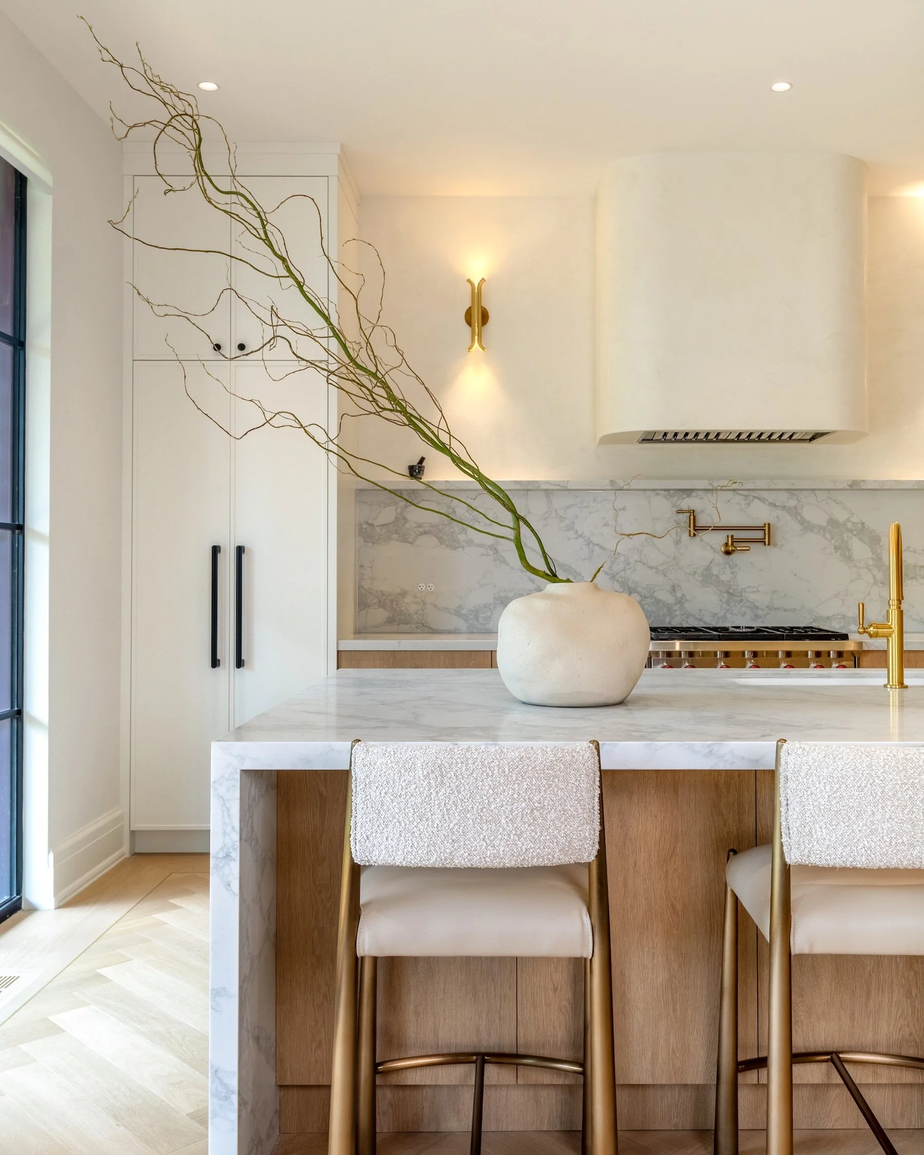 Custom kitchen with marble island and wood cabinetry in Etobicoke home renovation