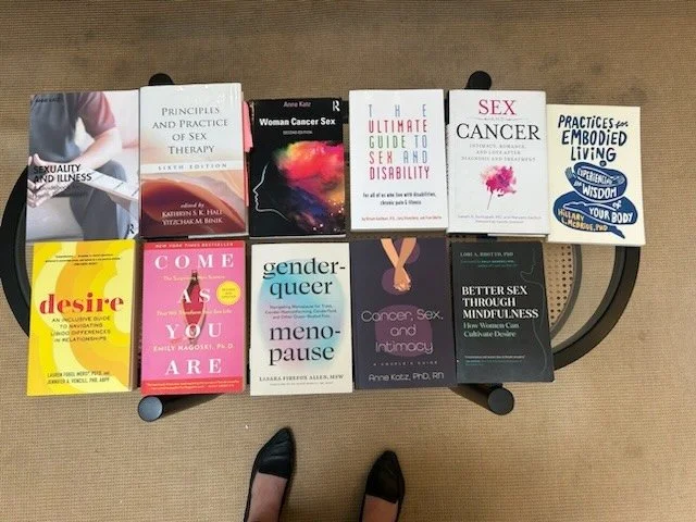 selection of books relating to sex, intimacy, menopause and cancer.