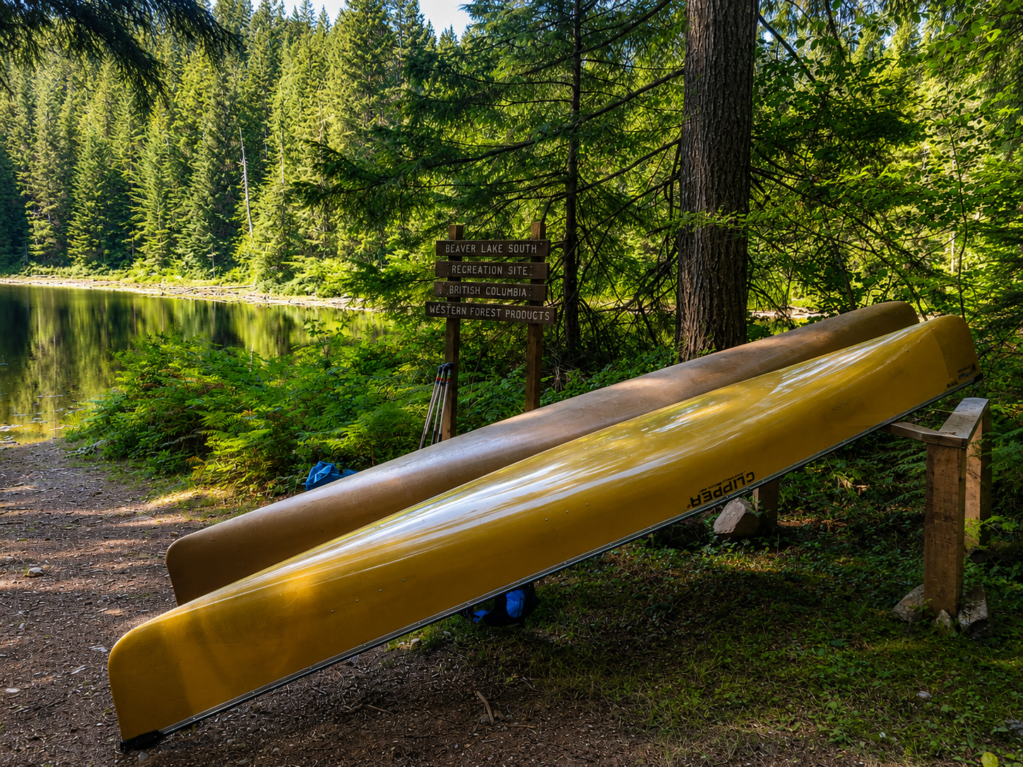 two canoes on a canoe rest at Beaver Lake, qathet.
