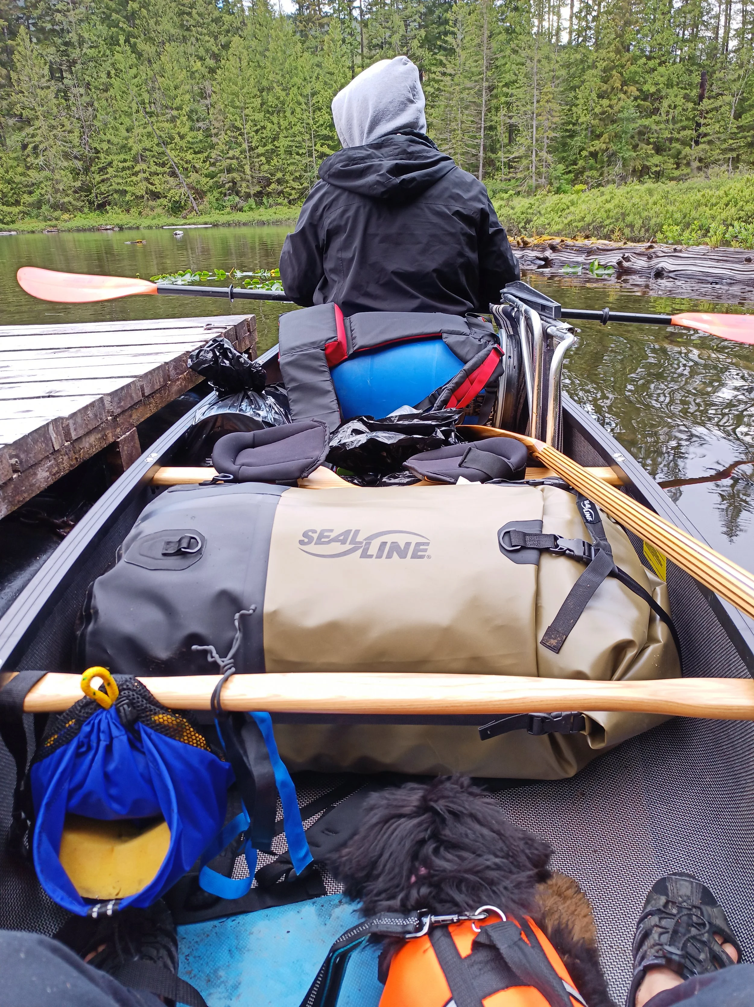 A loaded canoe with bow paddler waiting