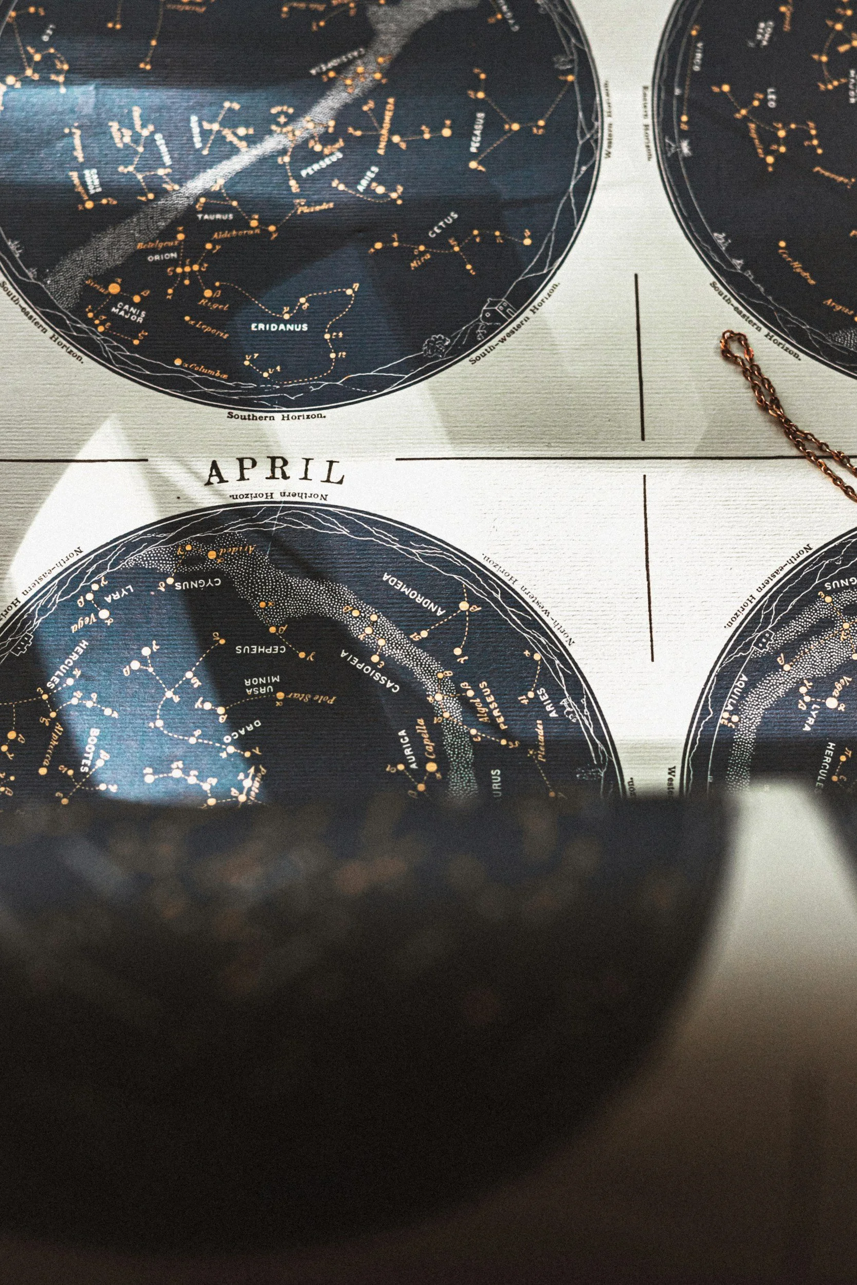 Star charts or celestial maps showing constellations and star positions for April.