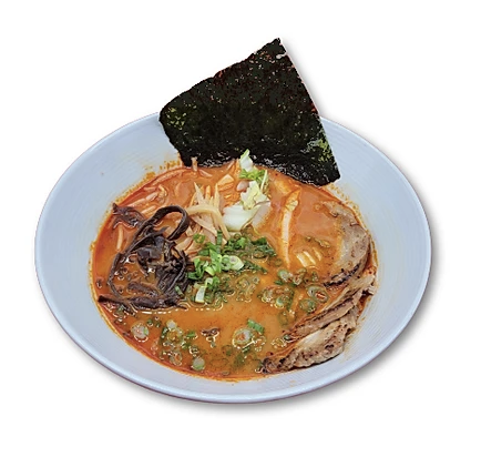 Bowl of spicy ramen with noodles, sliced pork, green onions, black mushrooms, and a sheet of nori.