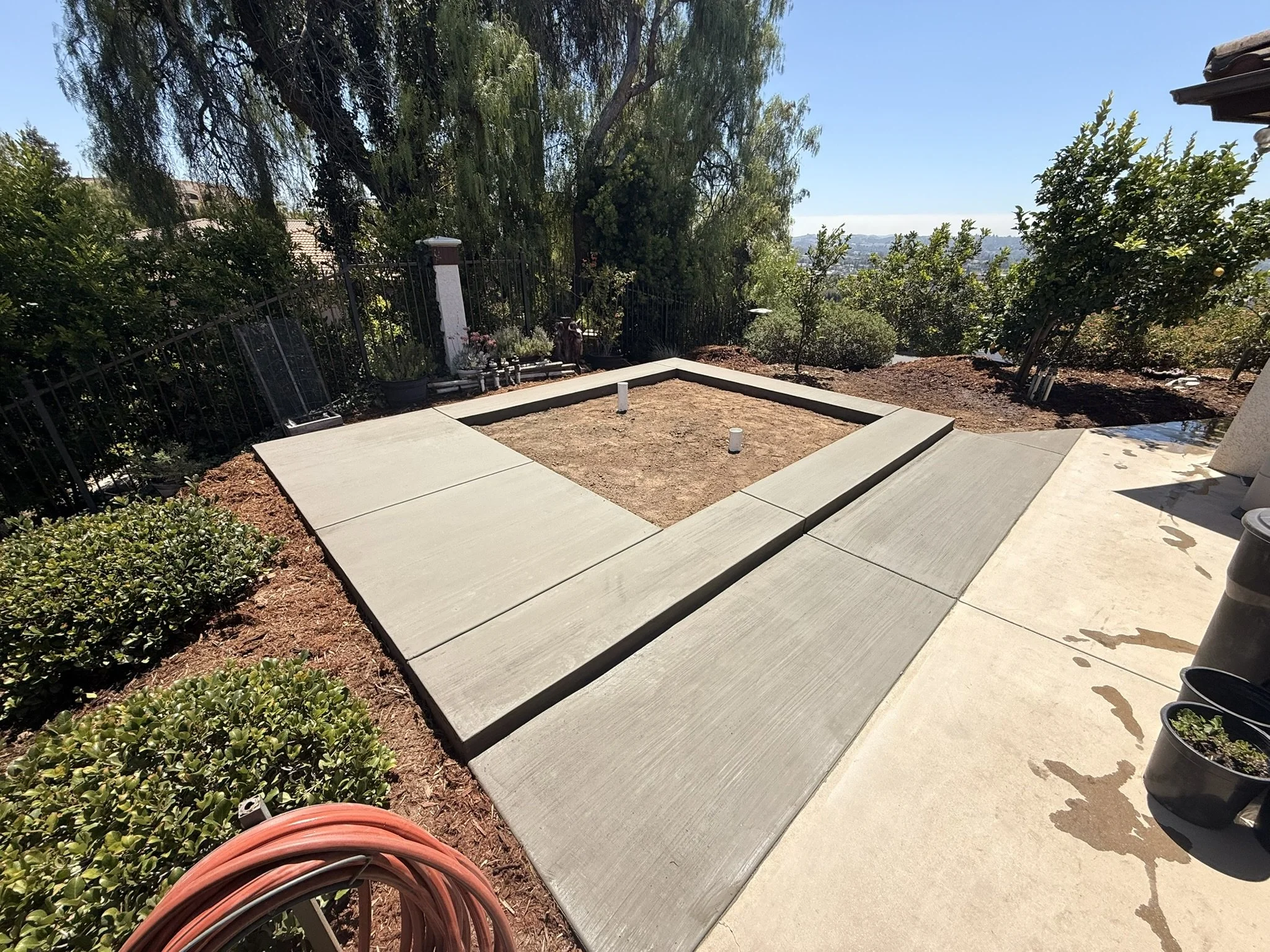 CONCRETE & FLATWORK | Concrete steps and perimeter flatwork during an outdoor project.
