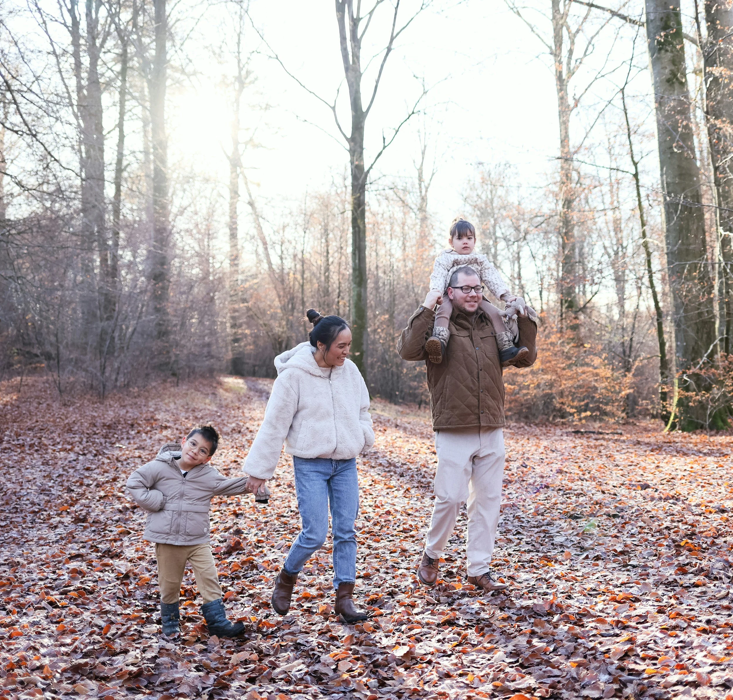 Happy Sonoma County family walking outside together after a chiropractic visit