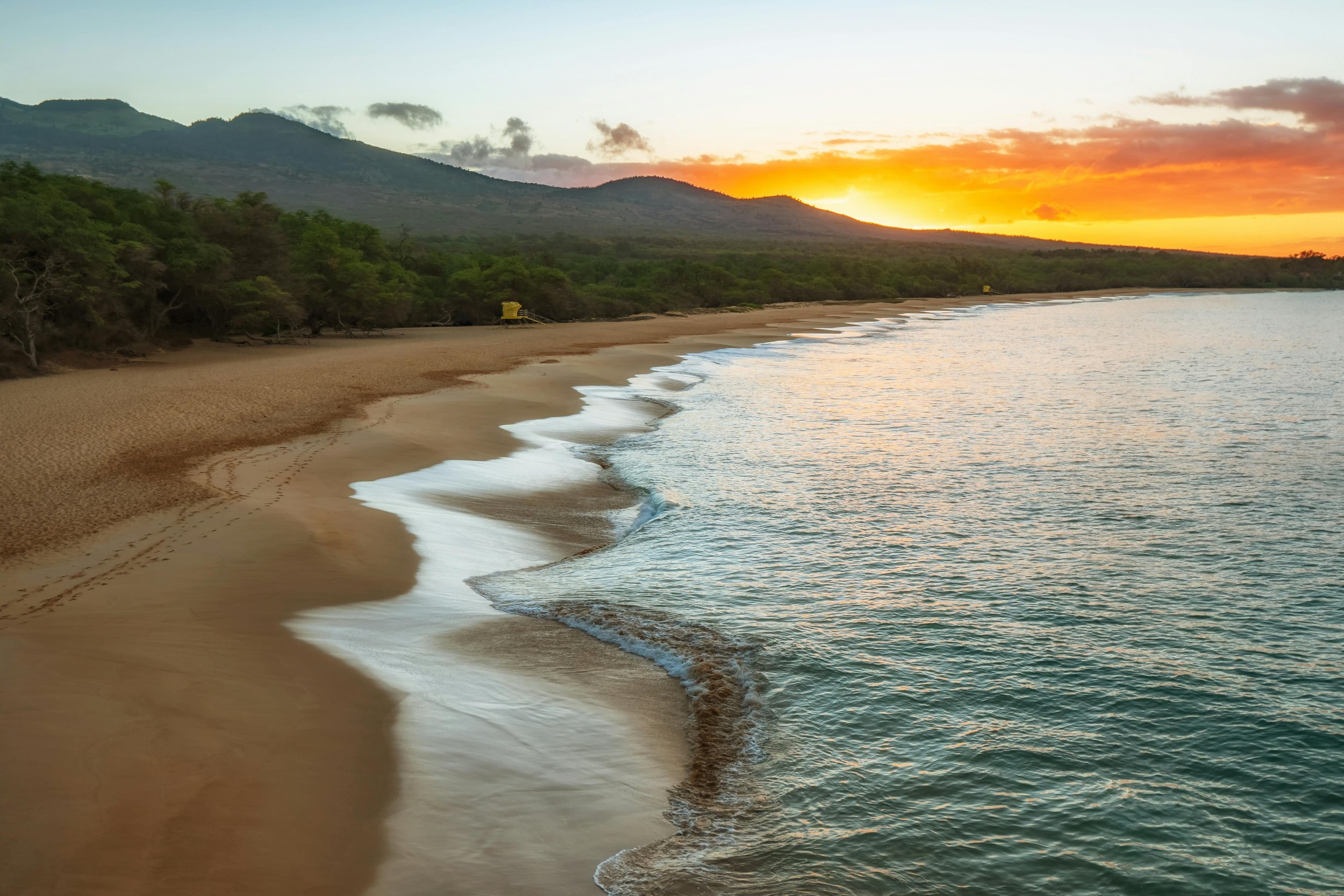 Aerial view of Maui coastline showing beaches, ocean, and lush landscape