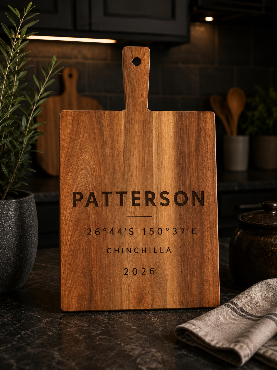 Personalised with your family name, location and coordinates, this design creates a subtle yet meaningful tribute to the place you call home.