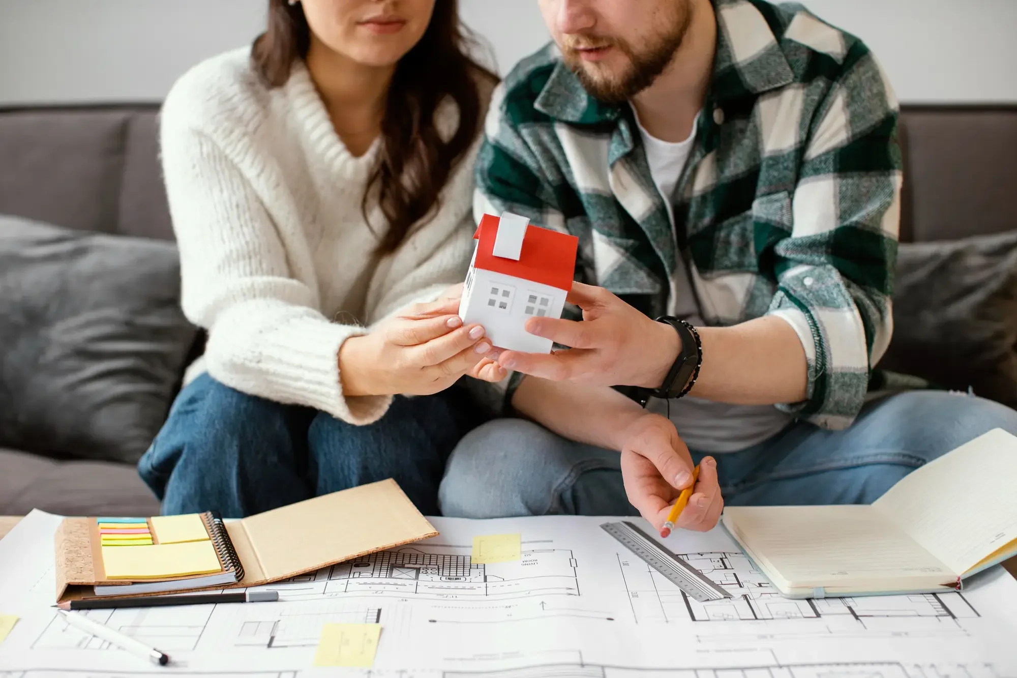 a young couple planning their first home