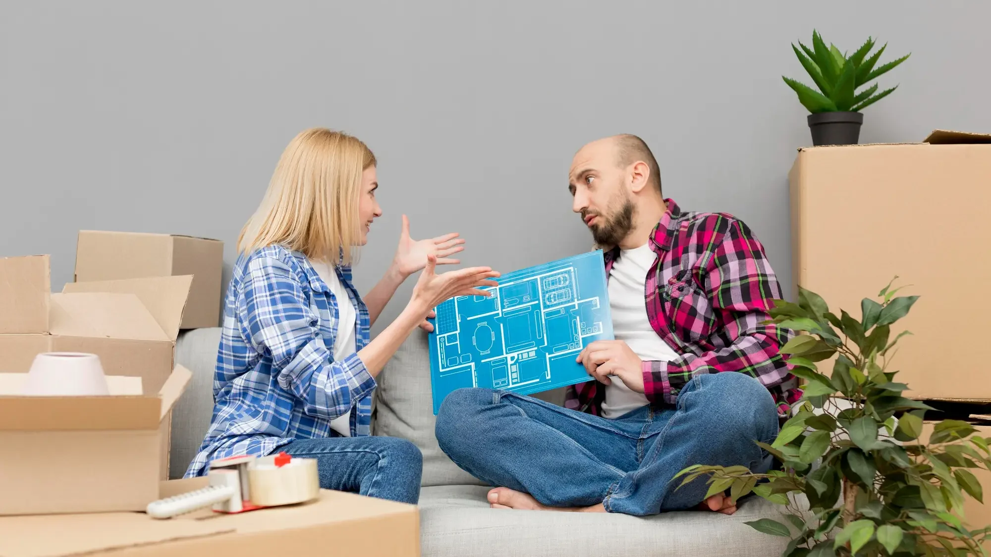 A young couple discussing and planning their new custom home build