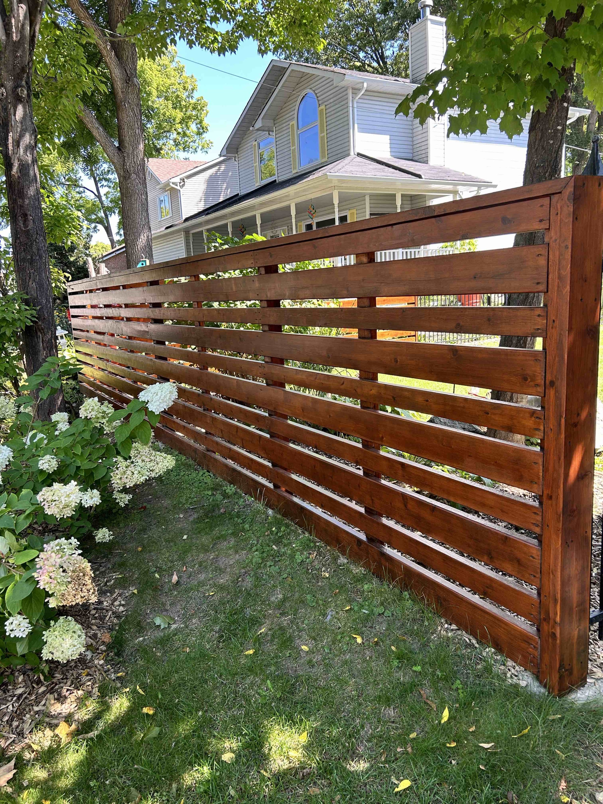 exterior fence staining in garden