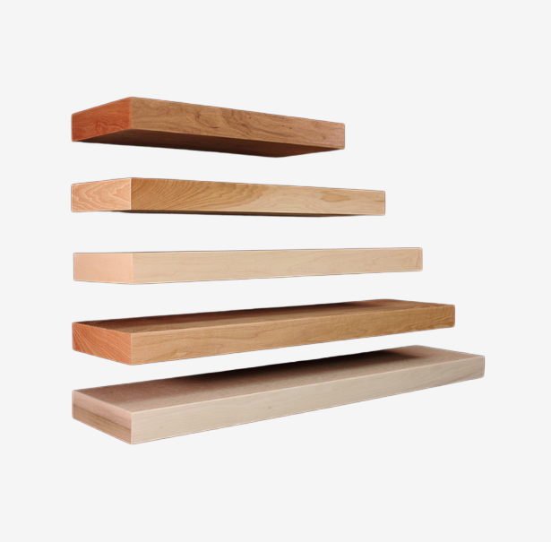 Six floating wooden shelves of varying sizes and wood tones against a white background.