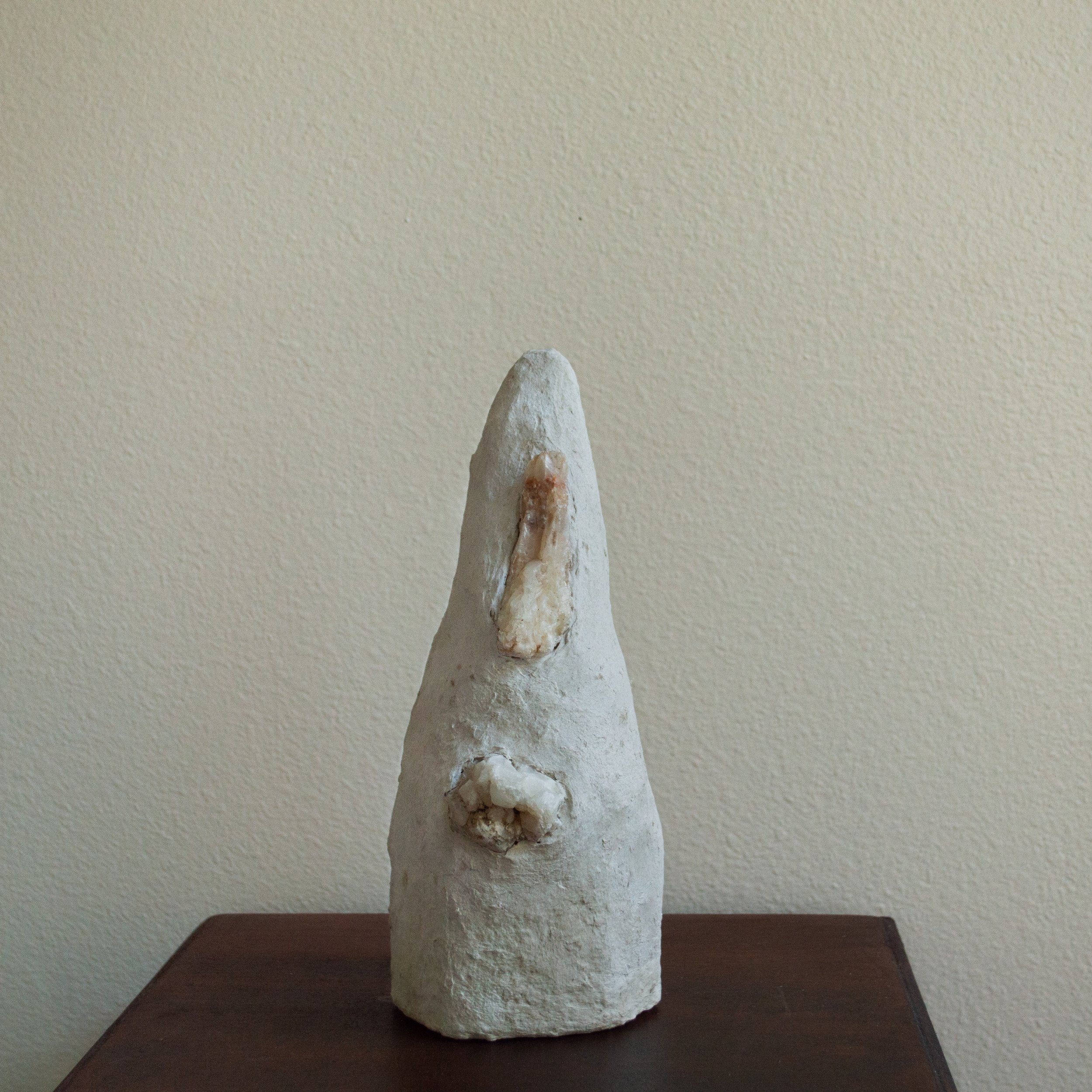 Crystal Tower, 2023. Paper pulp clay, found stones, 10”x4”diame
ter.