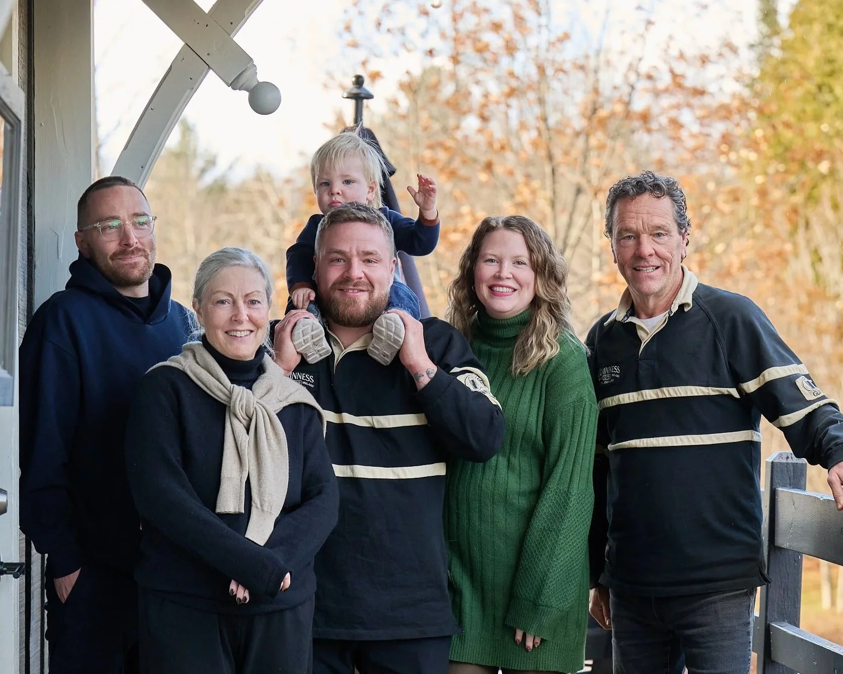 Robertson family standing outside MacTaverne in Val-David. Chef Mike Robertson and Tim Robertson hone pub classics in a relaxed setting worth the drive from Montreal.