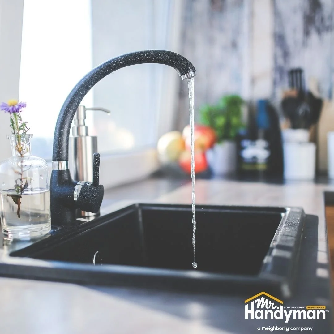 Kitchen faucet running with steady water flow, professional plumbing service by Mr. Handyman of Lehigh Valley