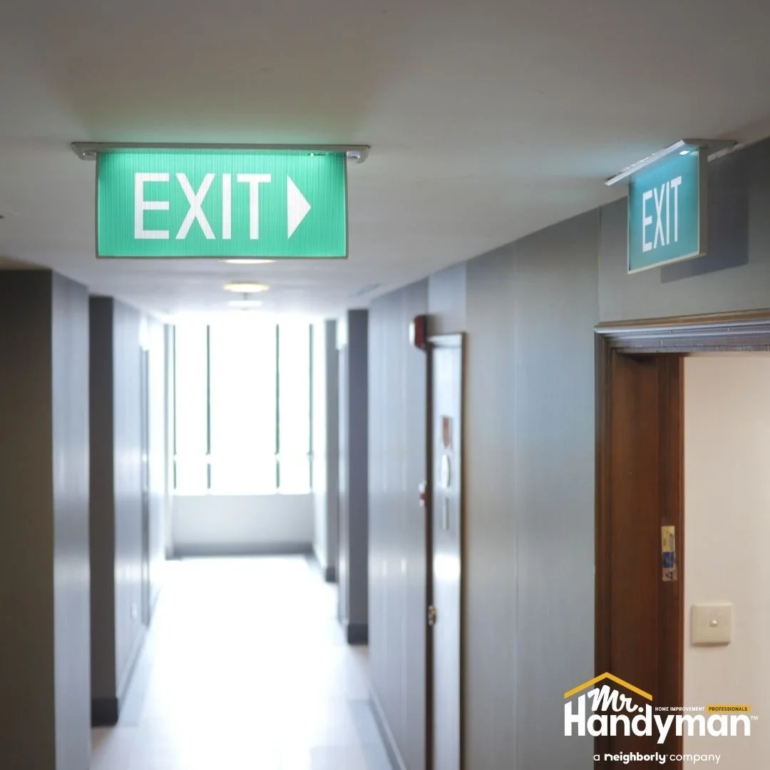 Illuminated exit signs in commercial hallway ensuring building safety compliance, commercial repair by Mr. Handyman of Lehigh Valley