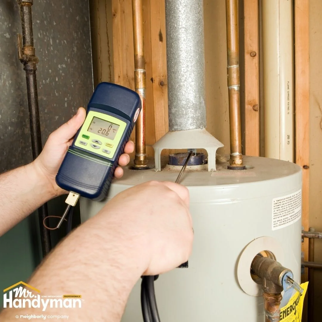Technician testing water heater performance and temperature for winter efficiency, water heater service by Mr. Handyman of Lehigh Valley