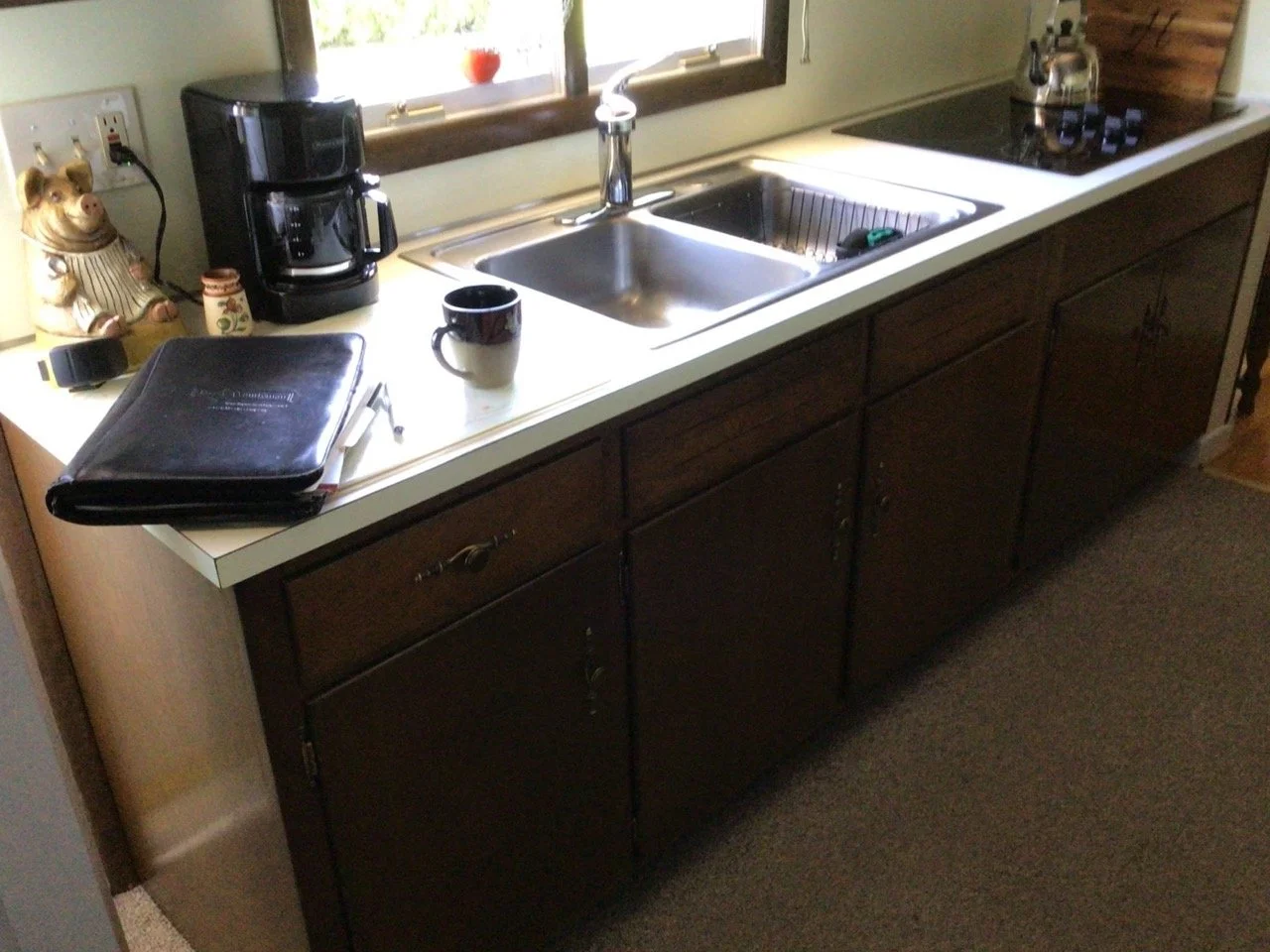 Old Easton kitchen with dark cabinets and outdated countertops pre-renovation.