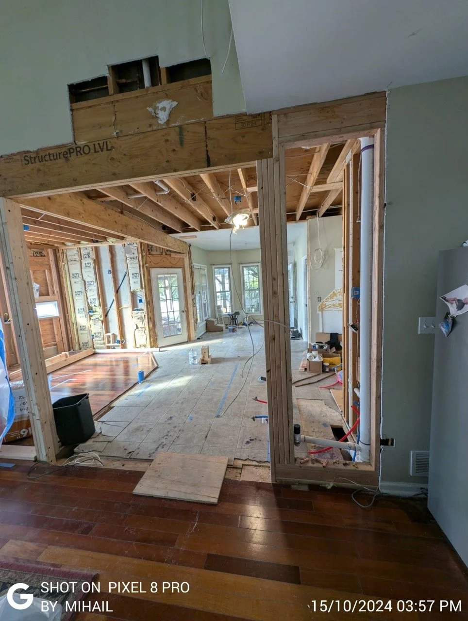 Exposed studs and floor during full kitchen structural renovation in PA by Mr. Handyman.