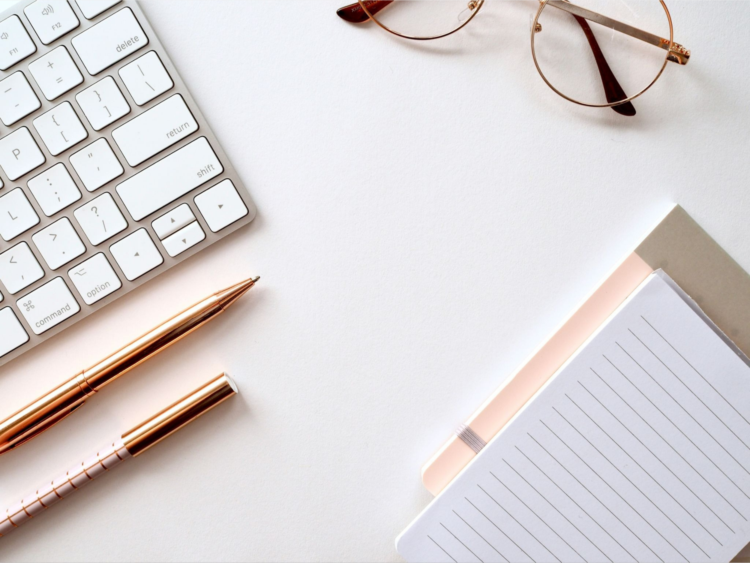 lose-up of organized desk drawers with simple dividers containing office supplies and stationery.