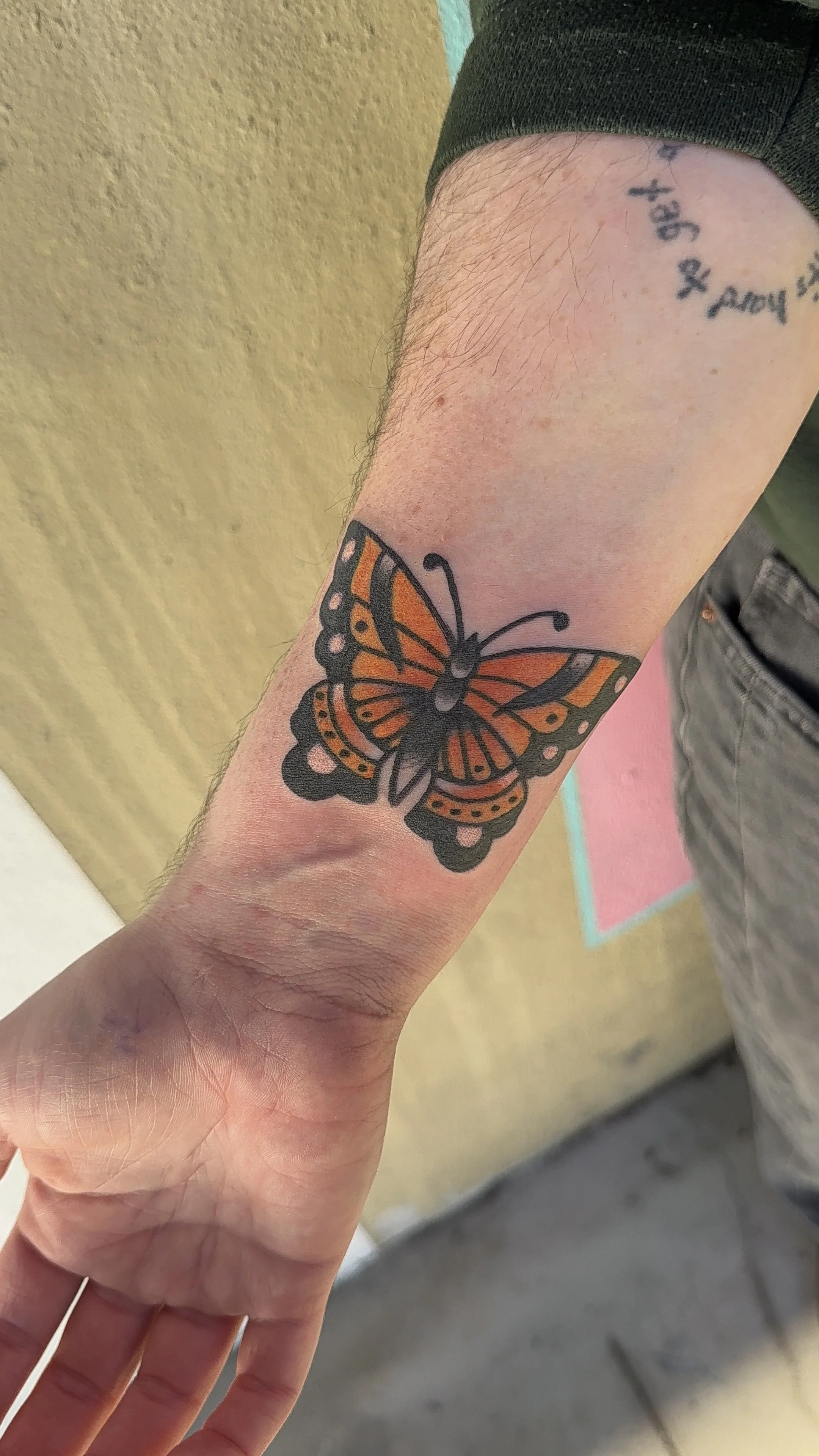 American Traditional Tattoo made in Portland, Oregon color tattoo of a Monarch Butterfly