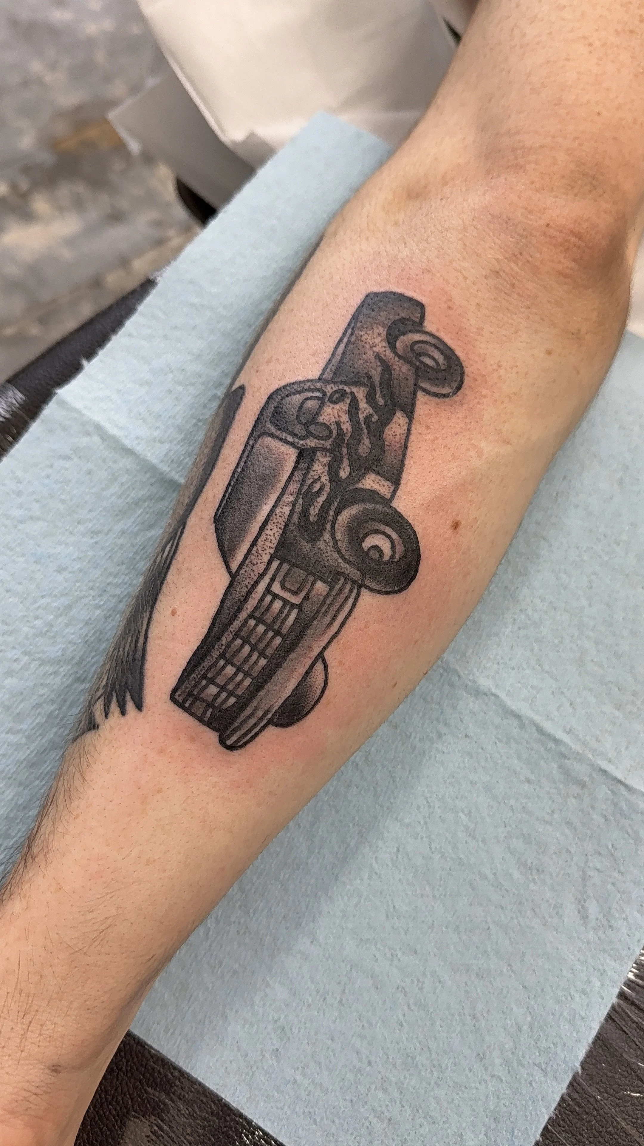 american traditional style pickup truck tattoo in black and grey