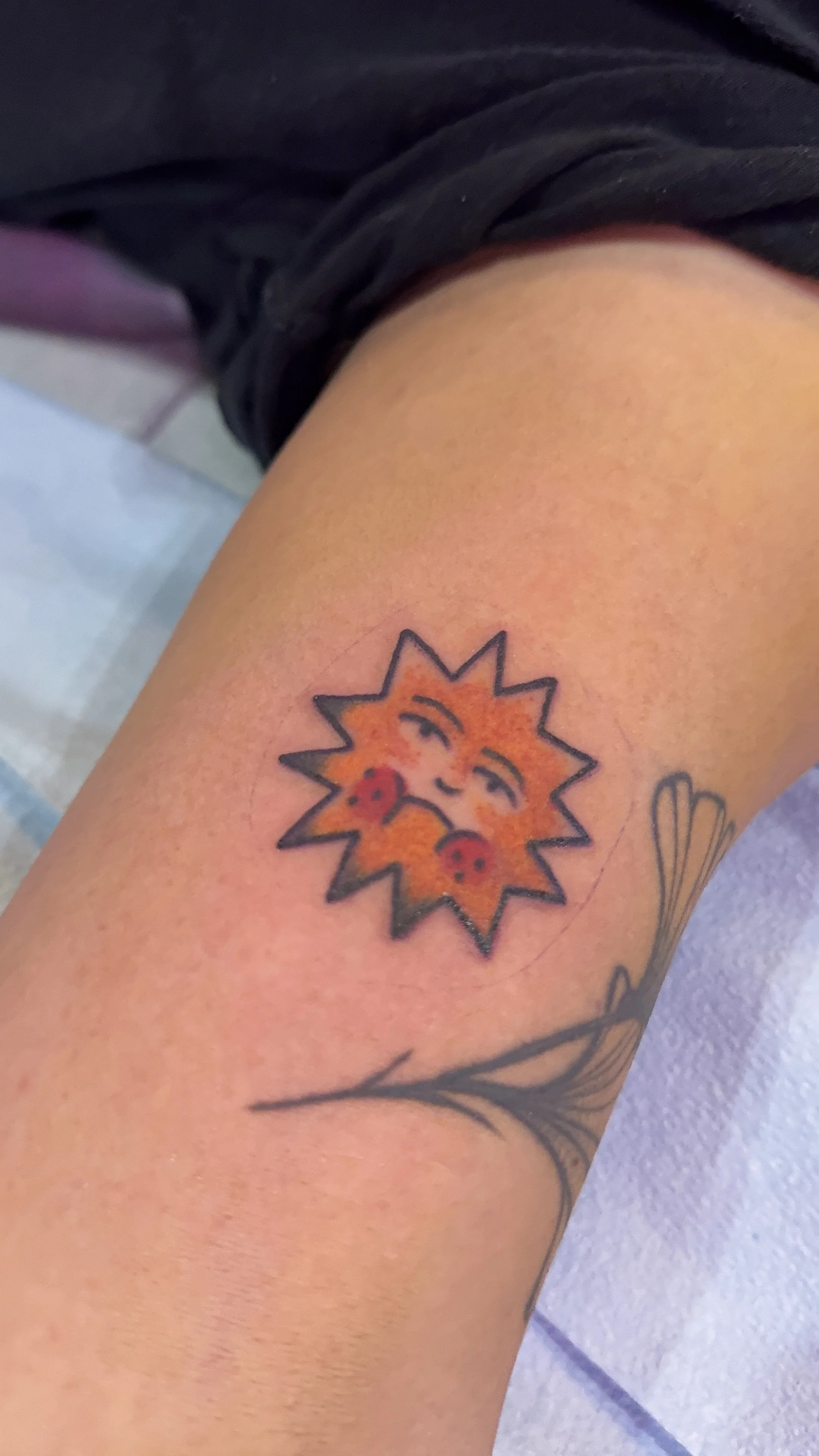 glum sad sun tattoo american traditional style