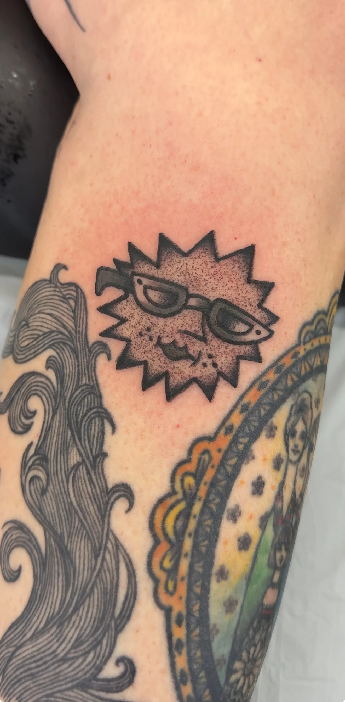 american traditional style black and grey sunshine tattoo