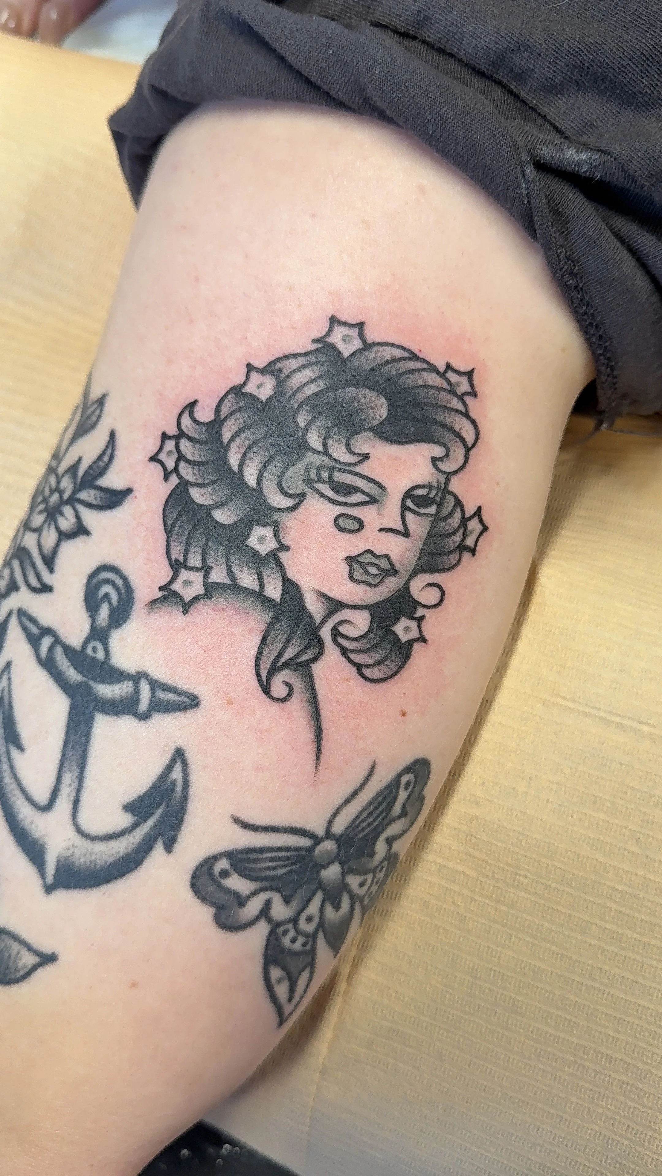 American Traditional Tattoo made in Portland, Oregon black and grey lady head tattoo filler 