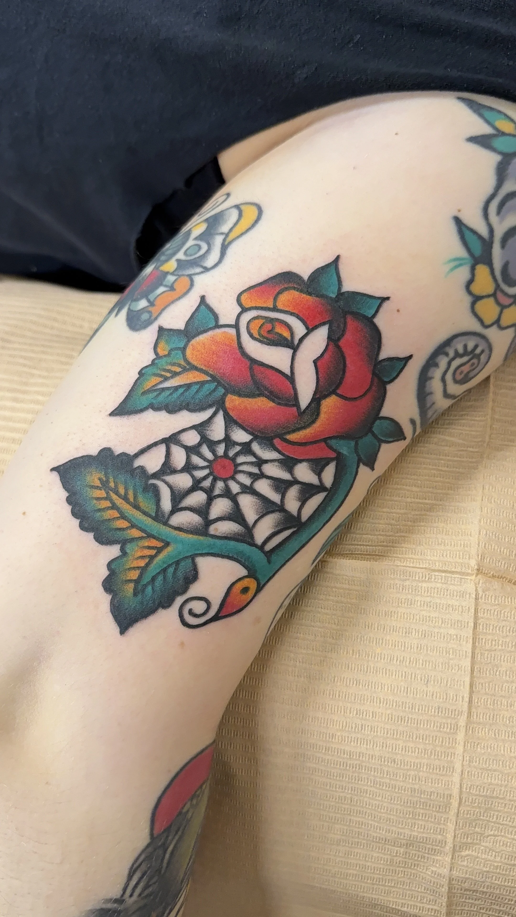 American Traditional Tattoo made in Portland, Oregon rose and spiderweb tattoo in color