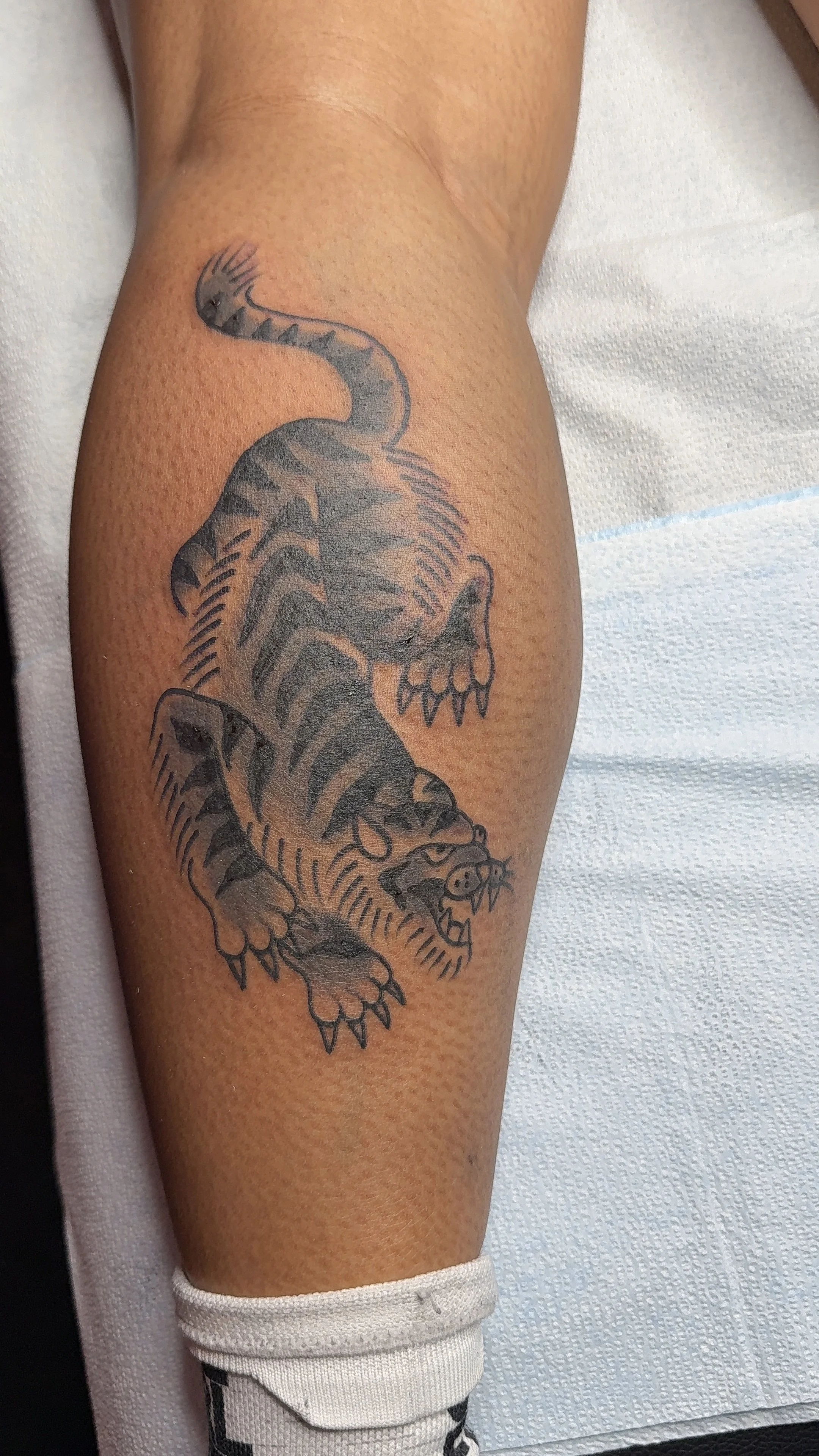 black and grey tiger tattoo american traditional style