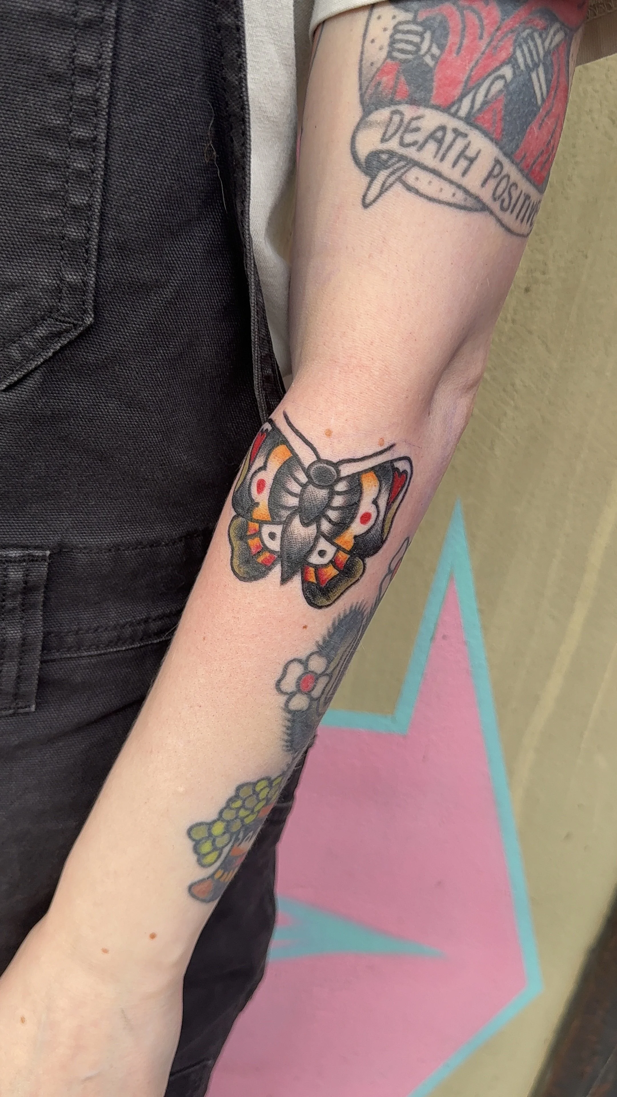 american traditional style heart shaped butterfly tattoo