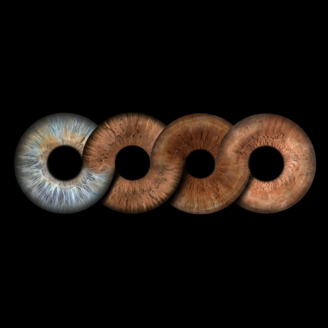Close-up of four human irises with black circular centers, arranged horizontally on a black background.