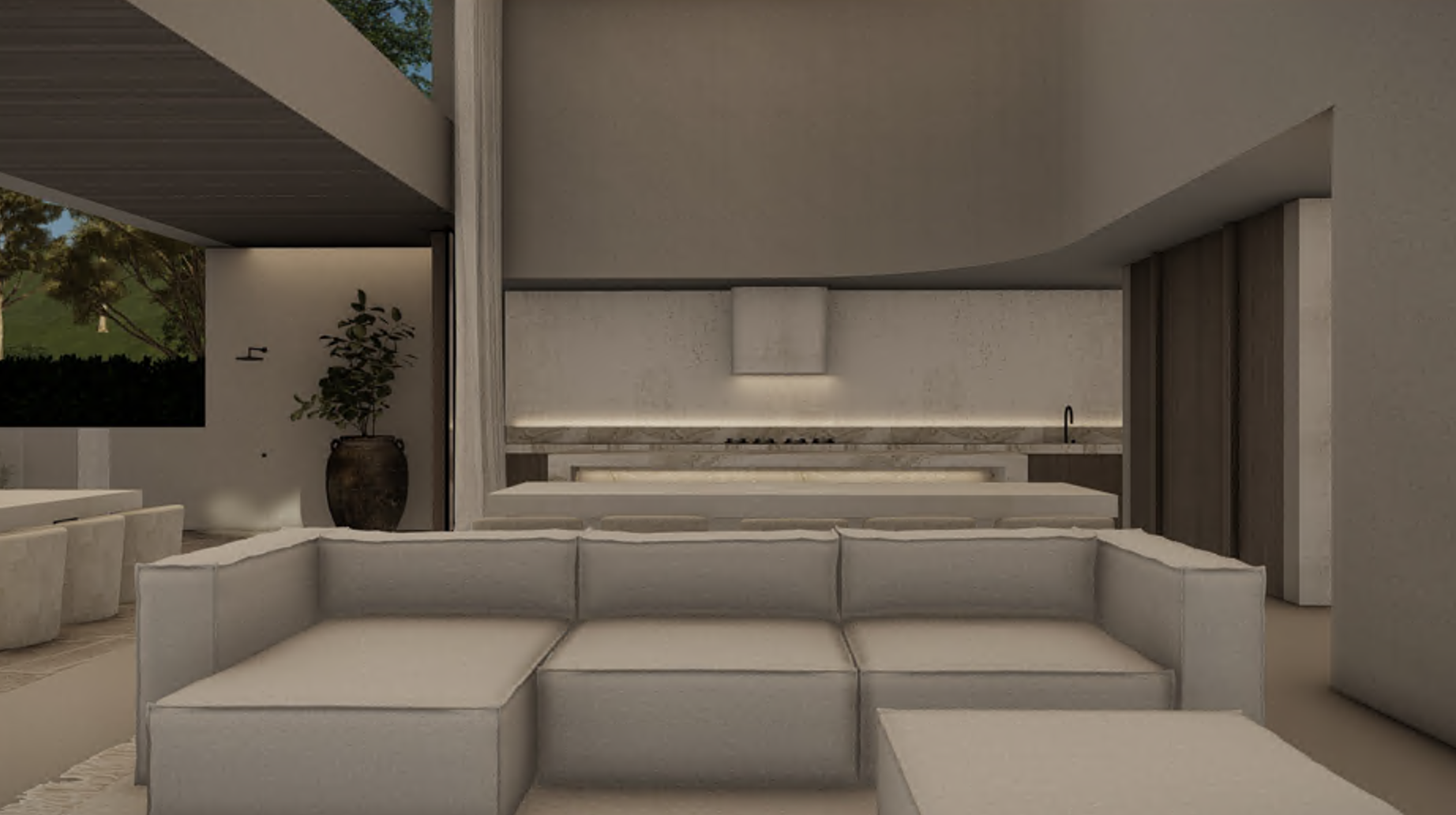 Modern open-concept living room with beige L-shaped sofa, kitchen with marble counters, built-in stove and range hood, potted plant, and large window showing trees outside.