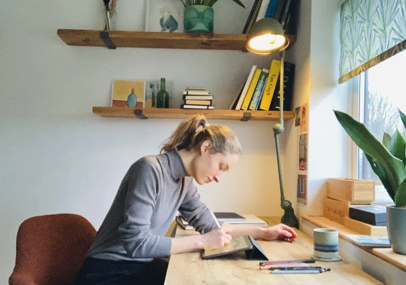 London based illustrator drawing at desk