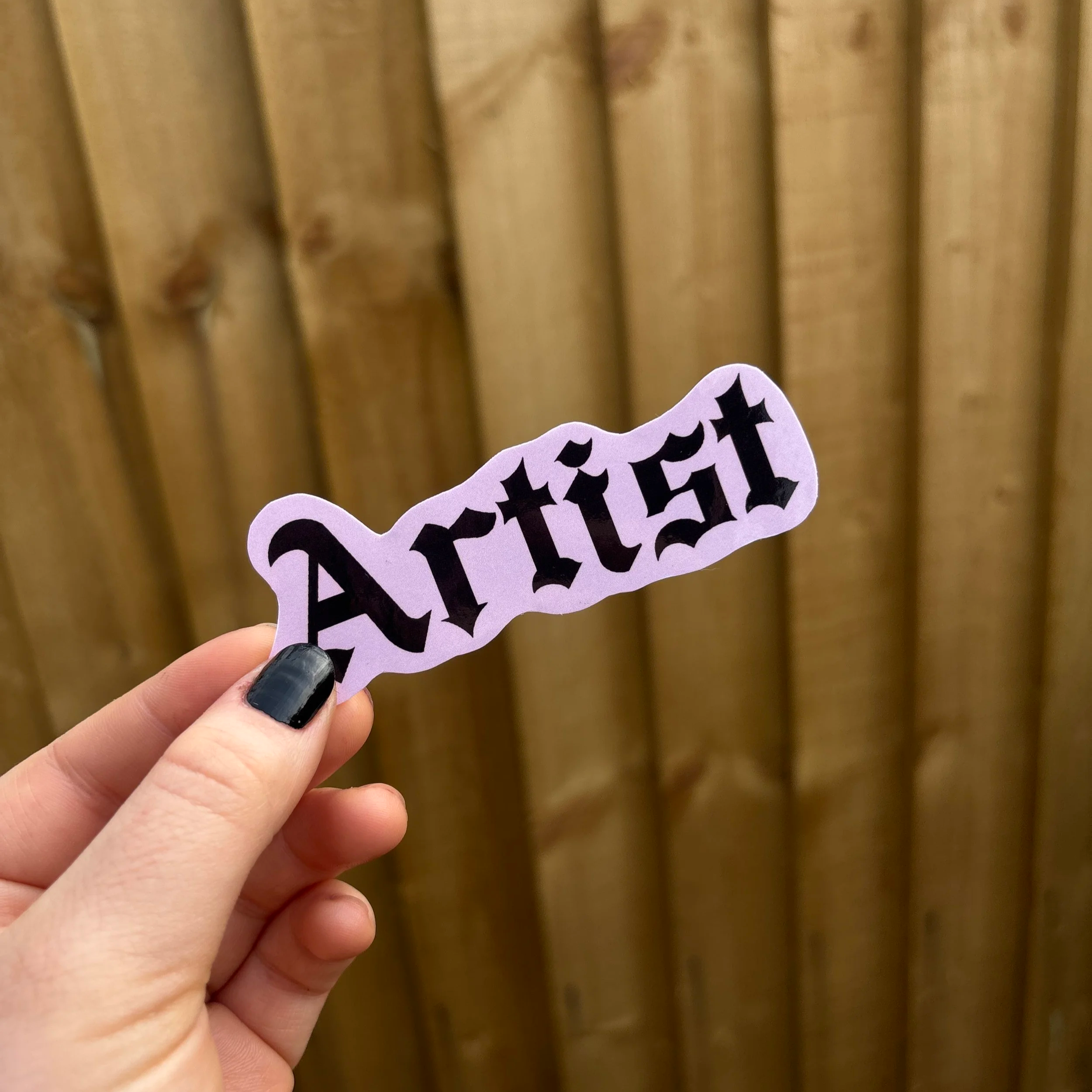 artist+sticker+holding+up.png
