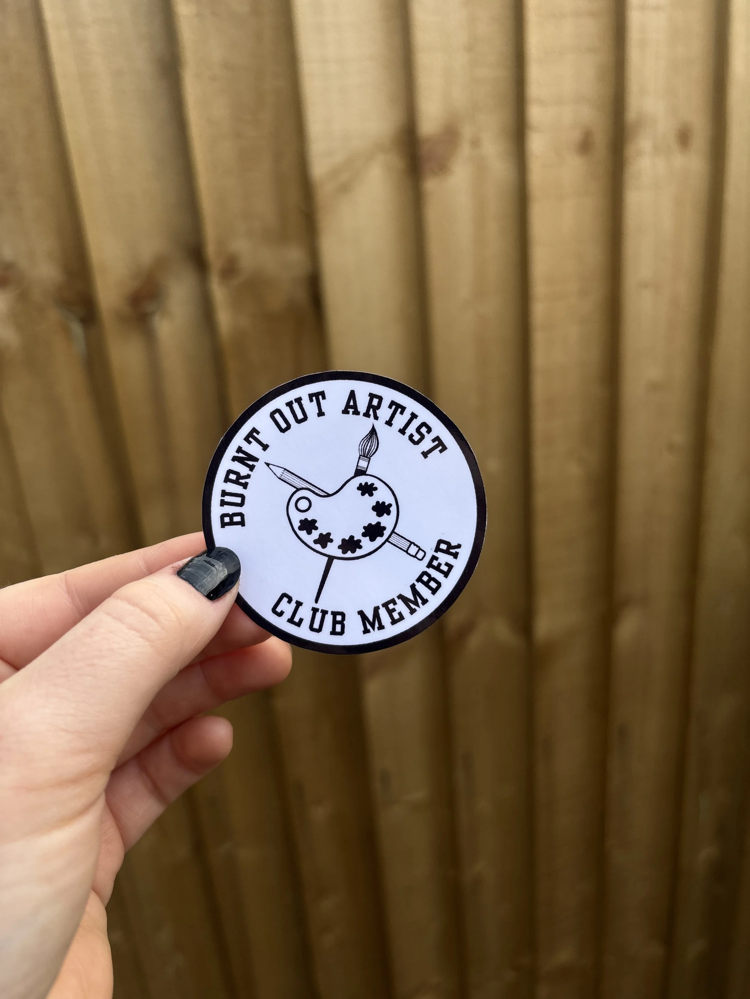 burnt out artist club member sticker holding up..JPG