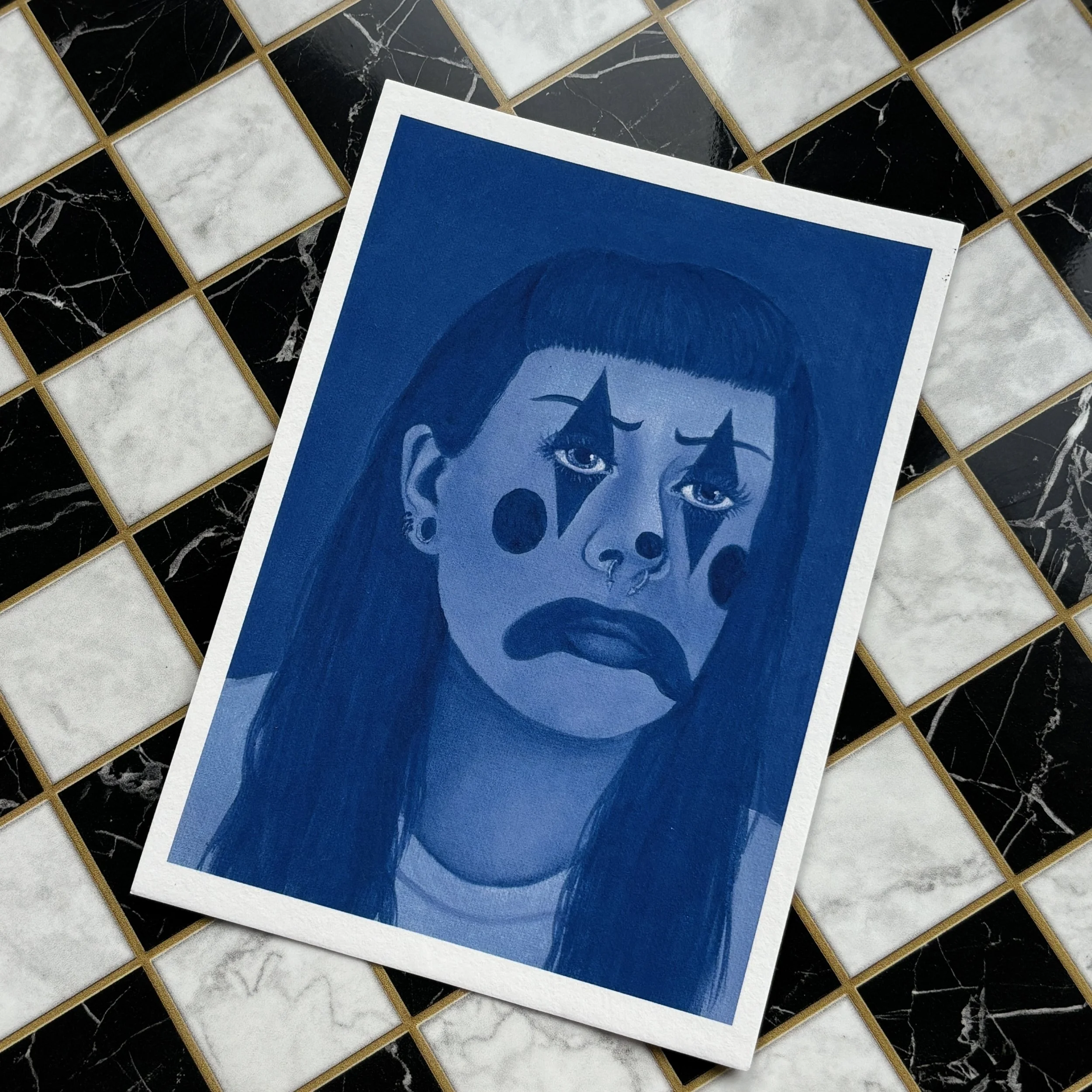 blue clown print flat lay checkerboard.jpg