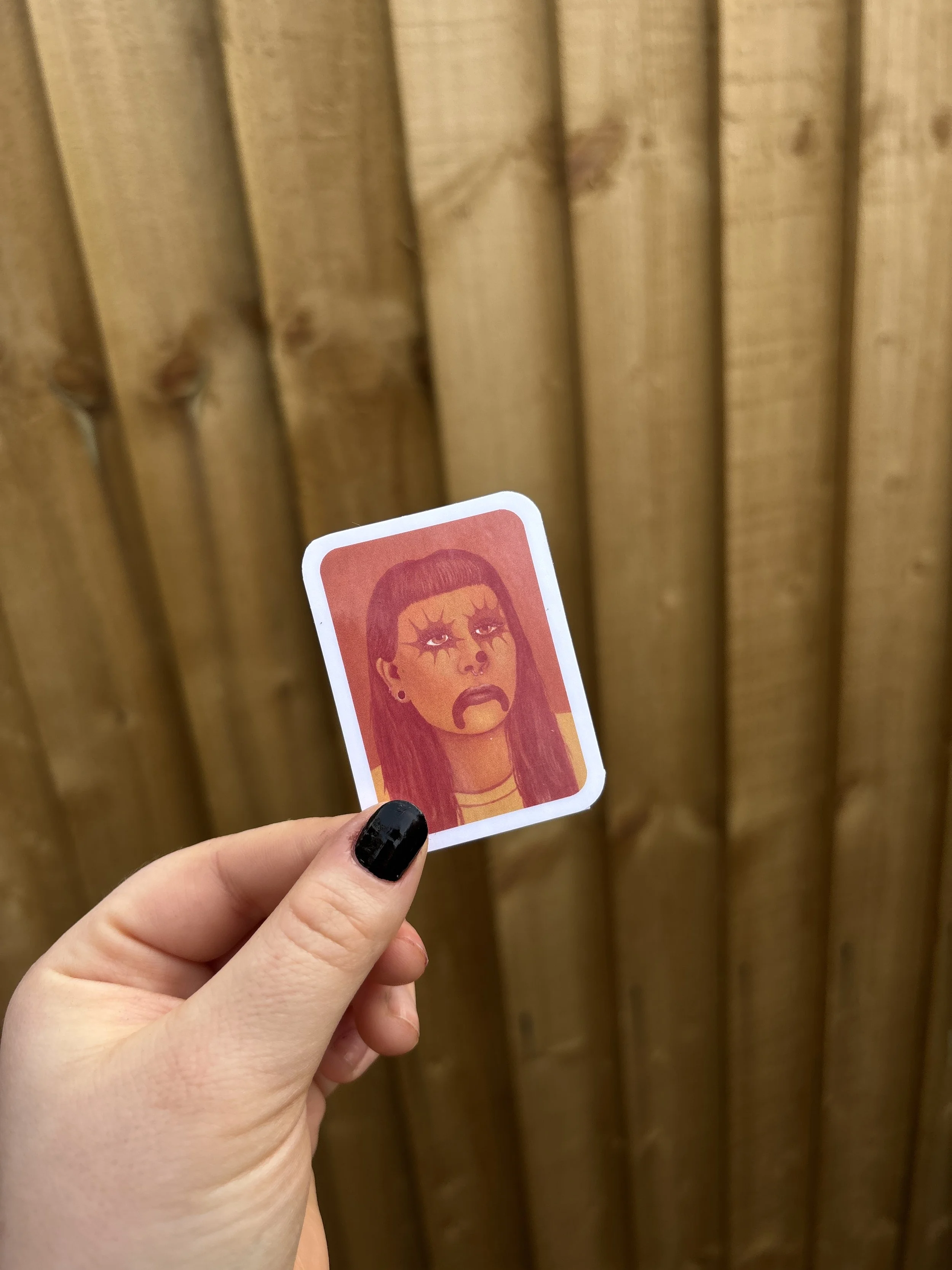 ornage clown sticker holding up..JPG