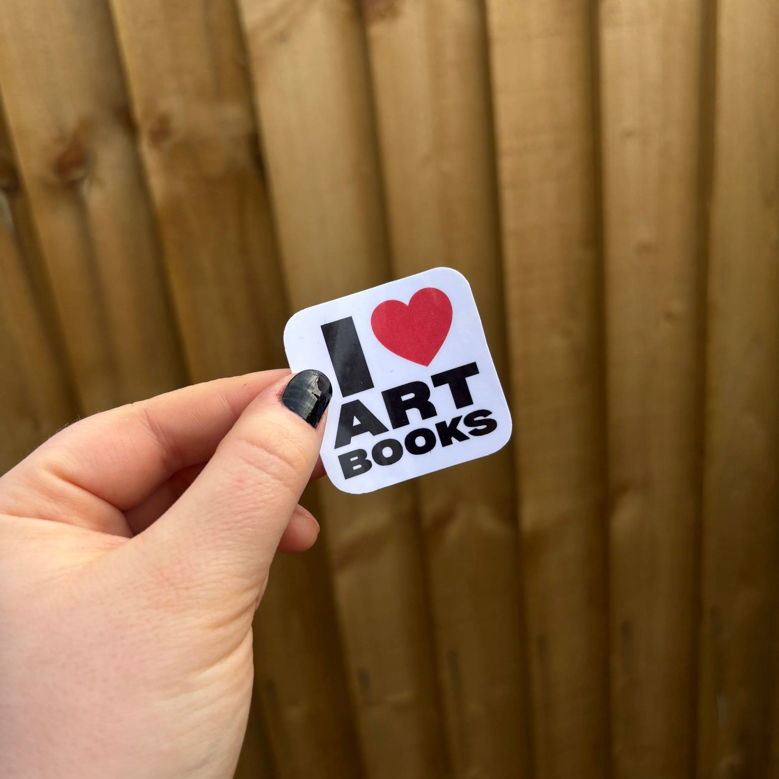 i+love+art+books+sticker+holding+up..png