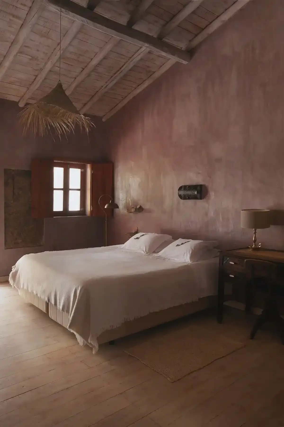Earth-toned bedroom at Muxima near Aljezur.