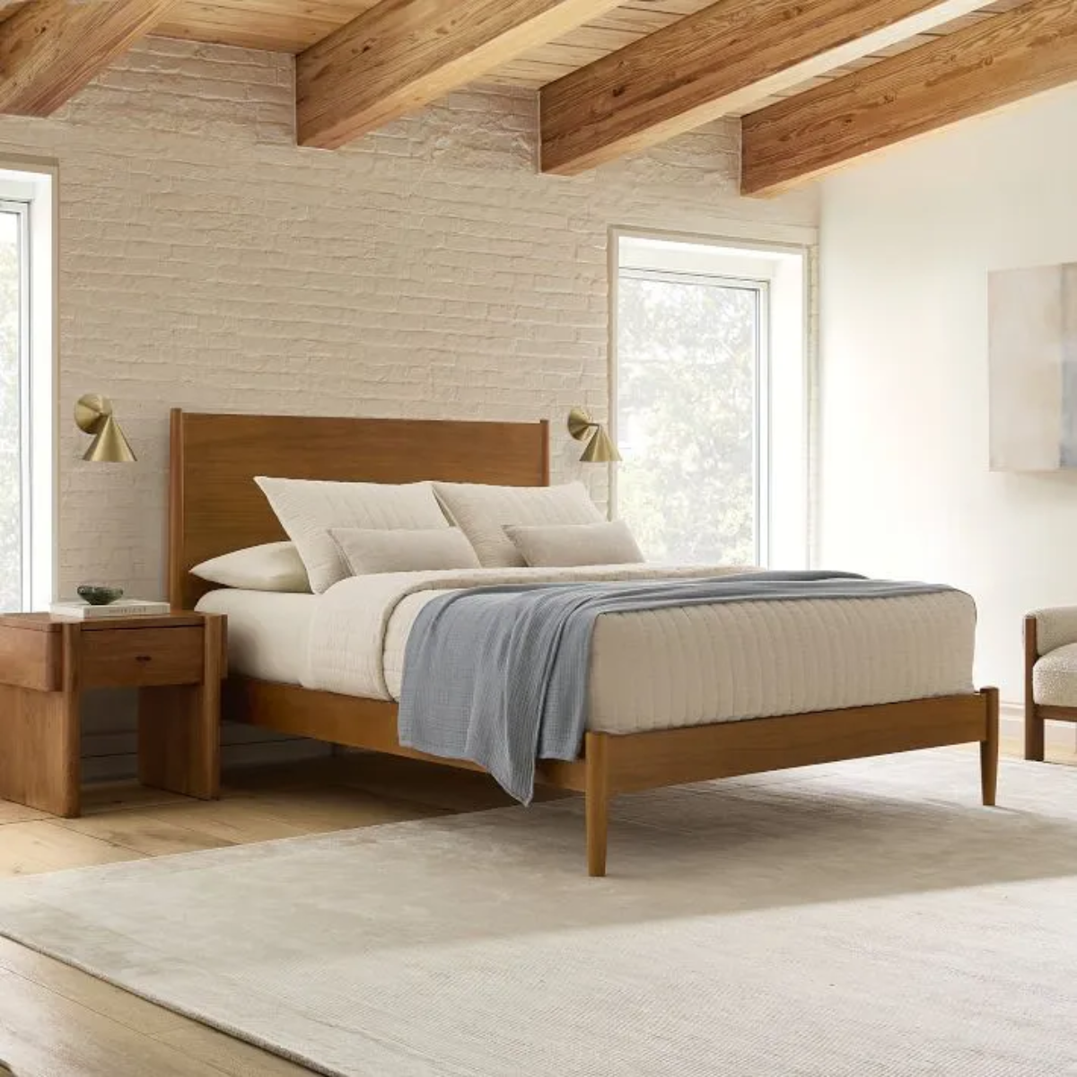 Light-filled bedroom with West Elm mid-century furniture.