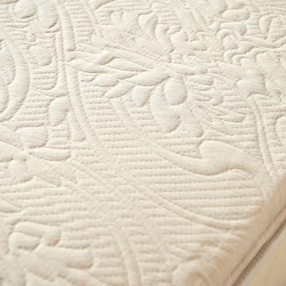  Embossed knit surface detail of Happsy organic latex mattress topper. 
