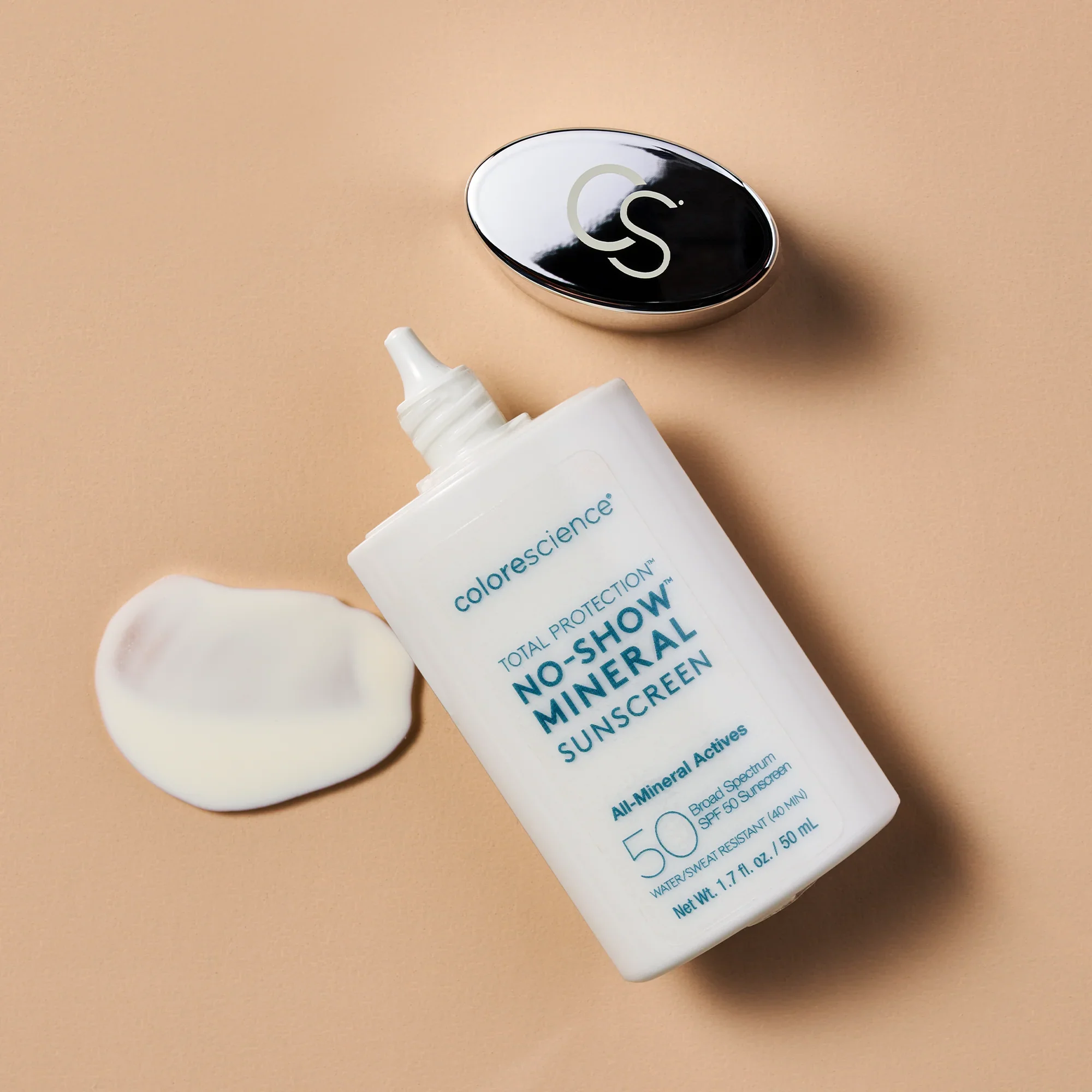 Colorescience No-Show Mineral Sunscreen SPF 50 bottle with lotion swatch on beige.