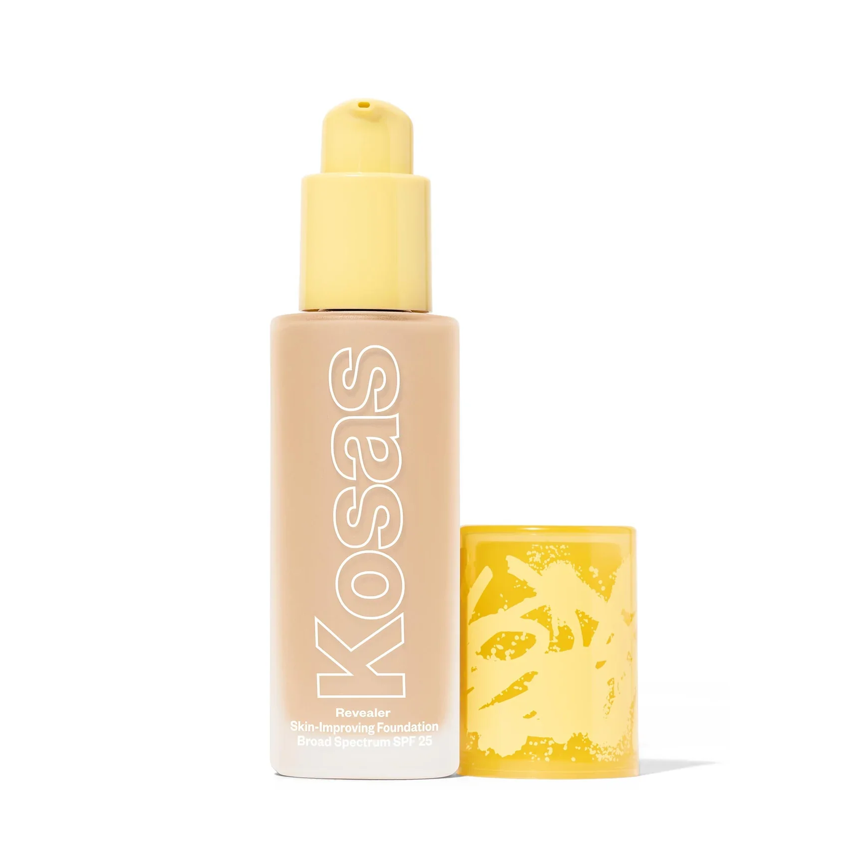 Kosas Revealer Skin-Improving Foundation with yellow pump and SPF 25, beige liquid visible inside frosted bottle.
