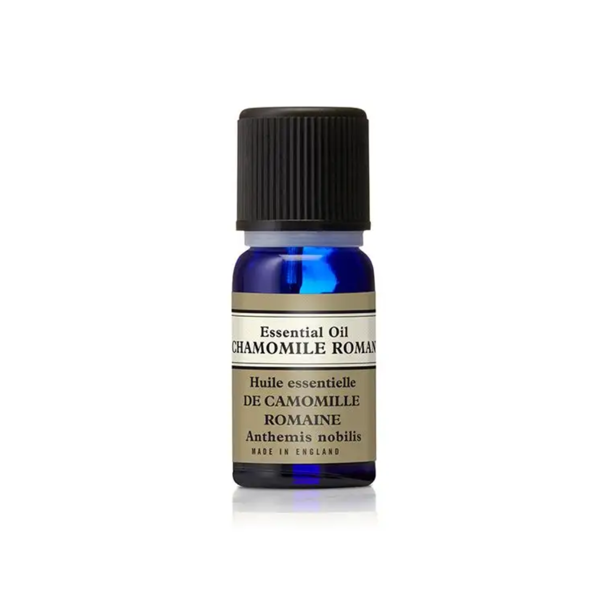 Cobalt blue Neal’s Yard Remedies Roman Chamomile Essential Oil bottle for calming aromatherapy and gentle skincare.